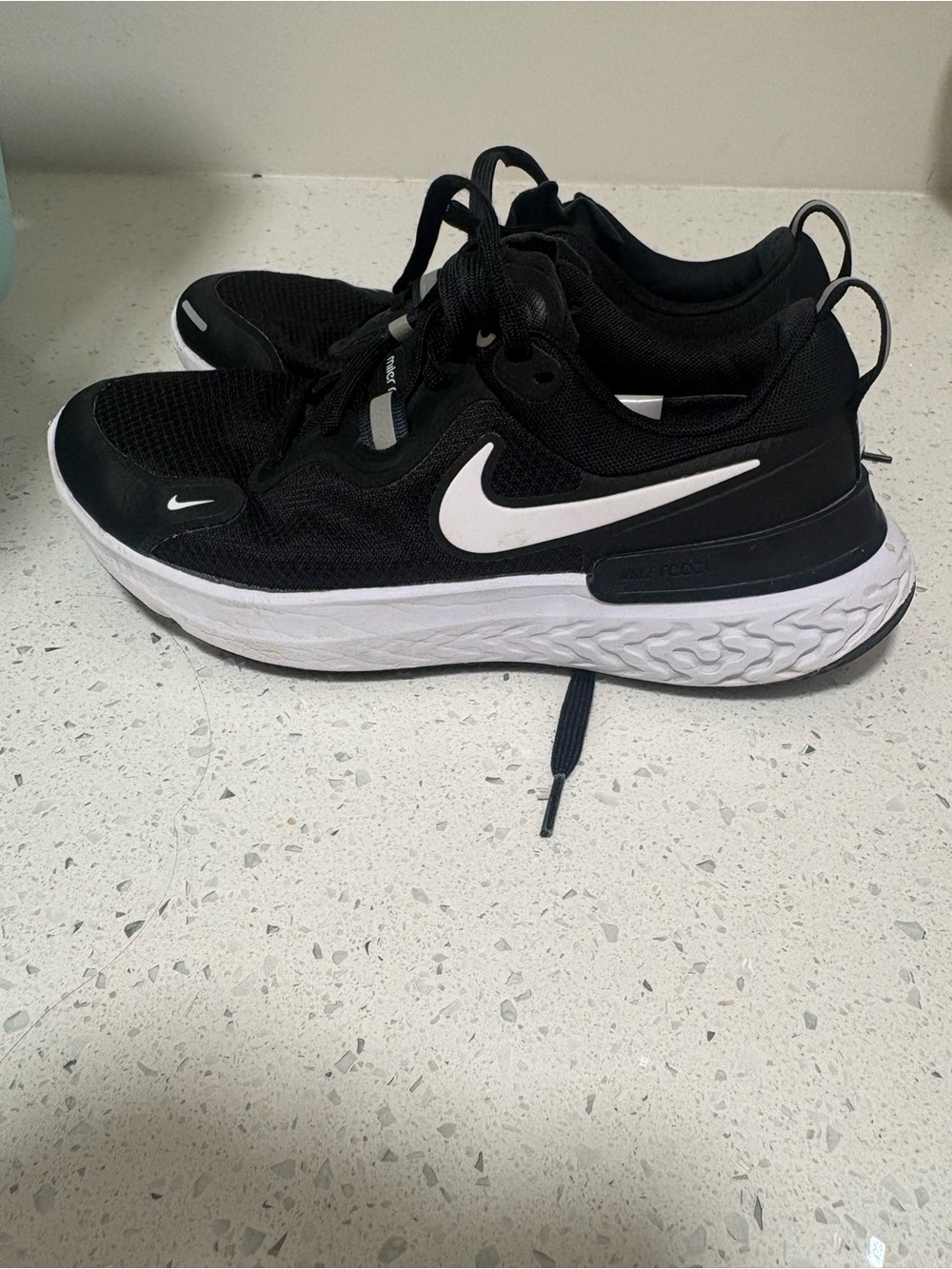 Nike Women’s Black and White Miler React Sneakers